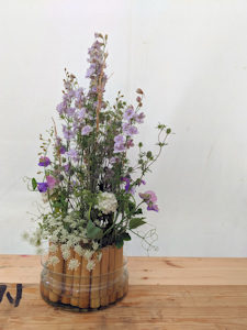floral arrangement with natural bamboo mechanics. Set in a glass bowl.