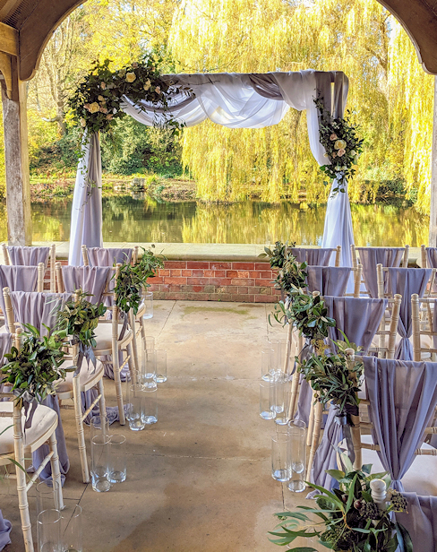 Floral Wedding Arch with Drapes.