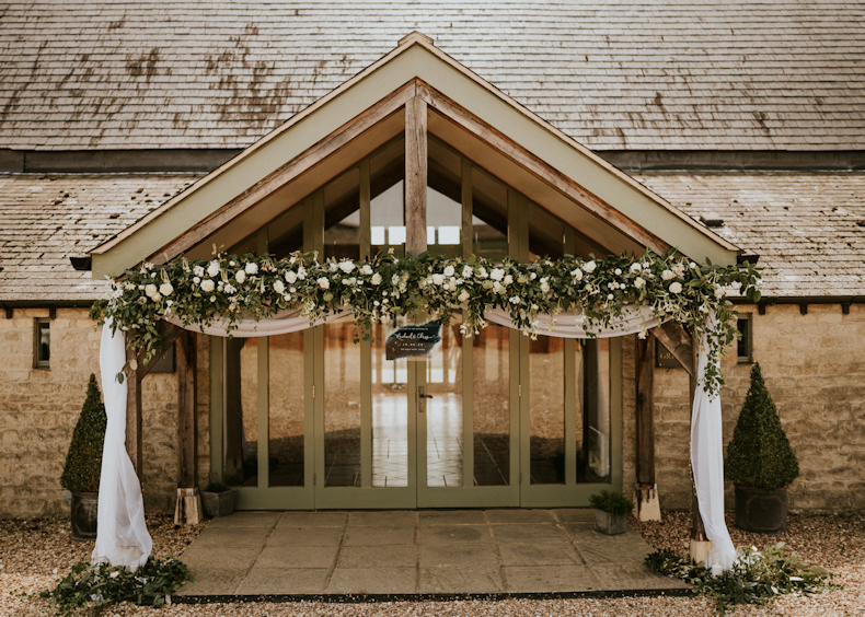 Floral entrance to wedding venue