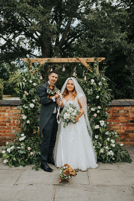 Bride and Groom with their dogs.